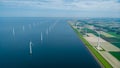 Windmill turbines at sea seen from a drone aerial view from above at a huge winmill park Royalty Free Stock Photo