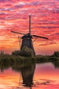 Windmill under a bloodred sky Royalty Free Stock Photo