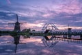 Windmill village Kinderdijk Netherlands, Sunset at the lake by the Dutch wind mill village with wooden windmills Royalty Free Stock Photo