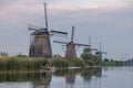 Windmill village Kinderdijk Netherlands, Sunset at the lake by the Dutch wind mill village with wooden windmills Royalty Free Stock Photo