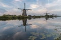 Windmill village Kinderdijk Netherlands, Sunset at the lake by the Dutch wind mill village with wooden windmills Royalty Free Stock Photo