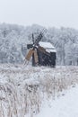 Windmill in Village Museum during snowy winter Royalty Free Stock Photo