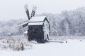 Windmill in Village Museum during snowy winter Royalty Free Stock Photo