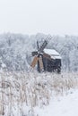 Windmill in Village Museum during snowy winter Royalty Free Stock Photo