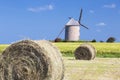 Windmill, wheat field and straw Royalty Free Stock Photo