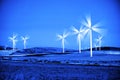 Windmill Wind Turbine Spinning in Wind at Sunset or Sunrise