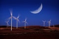 Windmill Wind Turbine Spinning in Wind wtih Moon Light