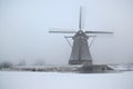 Windmill in winter in Holland Royalty Free Stock Photo