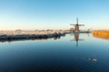 Windmill & x27;t Hoog- en Groenland with a refection in the Angstel river in the village Baambrugge in the Netherlands