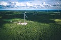 Windmills. Aerial view of windmills in green summer forest in Finland