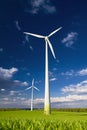 Windmills against a blue sky