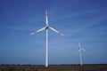 windmills against blue sky