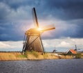 Windmills against cloudy sky at sunset in Kinderdijk, Netherland Royalty Free Stock Photo