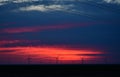 Windmills against a rainbow evening sky