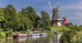 Windmills along the river in Greetsiel Royalty Free Stock Photo