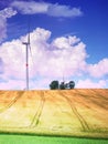 Windmills in countryside landscape. Nature landscape. Sunset in wheat field Royalty Free Stock Photo