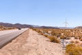 Windmills in Dry desert in southern california USA on bright hot day in summer