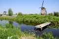 Windmills in Dutch landscape Royalty Free Stock Photo