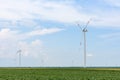 Windmills for electric power production. High angle shot of wind turbines on an open landscape in the serbian countryside during t Royalty Free Stock Photo