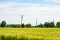 Windmills for electric power production, Hooksiel, Wangerland, Germany. Copy space for text. Royalty Free Stock Photo