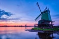 Windmills at famous tourist site Zaanse Schans in Holland with dramatic sky. Zaandam, Netherlands