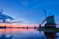 Windmills at famous tourist site Zaanse Schans in Holland with dramatic sky. Zaandam, Netherlands