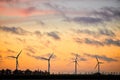 Windmills on field during sunset Royalty Free Stock Photo