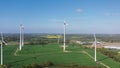 Windmills in field