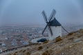 Windmills in the fog in Consuegra town in Spain Royalty Free Stock Photo