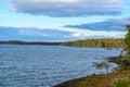 Windmills in forest behind lake Vattern Sweden Royalty Free Stock Photo