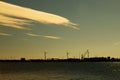 Windmills on island Mussalo in Baltic Sea at sunset, Kotka, Finland Royalty Free Stock Photo