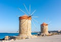 Windmills in Mandraki harbor, Rhodes island, Greece Royalty Free Stock Photo