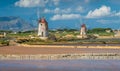 Windmills at the natural reserve of the `Saline dello Stagnone` near Marsala and Trapani, Sicily.