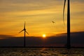 Windmills on open water for green energy on the IJsselmeer seen the inland sea of the Netherlands.