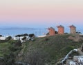 Windmills in Patmos, Greece at sunset