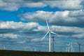 Windmills on the plains of Oklahoma under a dramatic cloudy sky