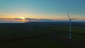 Windmills producing energy in rural landscape. Wind turbines generating power Royalty Free Stock Photo