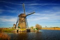 Windmills at riverside on a sunny day, Netherlands