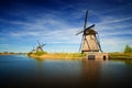 Windmills at riverside on a sunny day, Netherlands