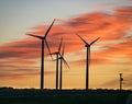 Windmills with sunset in the background in Texas. Clean Energy Transition Concept Royalty Free Stock Photo