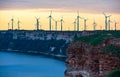 Windmills on the steep bank in Norway at the evening