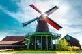 Windmills. Summer at Zaanse Schans. Authentic dutch landscape with old wind mills. Holland, Netherlands Royalty Free Stock Photo