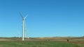 Windmills on a sunny day with a cloudless sky and space for text Royalty Free Stock Photo