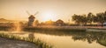 Windmills sunrise at Royalty Free Stock Photo