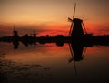 Windmills at sunset in Holland Royalty Free Stock Photo