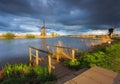 Windmills at sunset in Kinderdijk, Netherlands. Rustic landscape