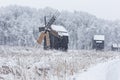 Windmills in Village Museum during snowy winter Royalty Free Stock Photo