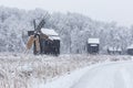 Windmills in Village Museum during snowy winter Royalty Free Stock Photo