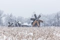 Windmills in Village Museum during snowy winter Royalty Free Stock Photo