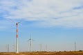 Windmills on the way to Sam Sand Dunes Thar Desert from Jaisalmer, Rajasthan, India. The Jaisalmer Wind Park is India`s 2nd